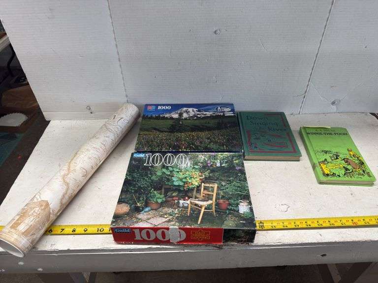 ASSORTED BOOKS, PUZZLES, AND A MAP OF MONTANA