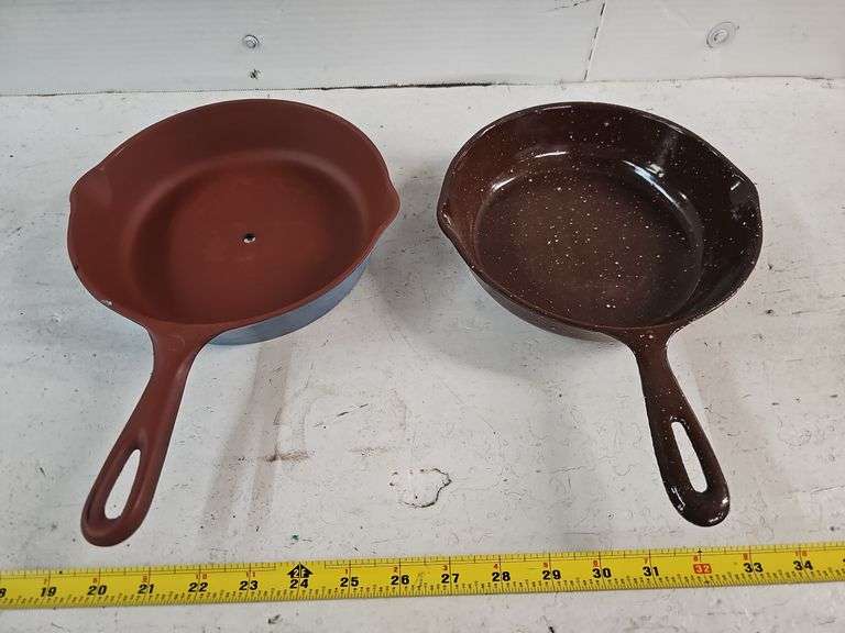 PAIR OF CAST IRON SKILLETS (1 HAS HOLE DRILLED IN CENTER)