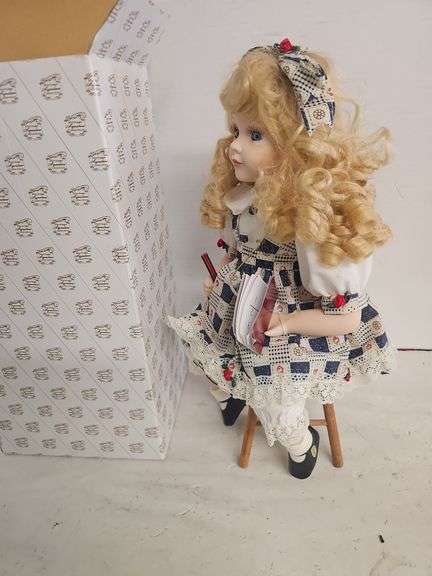 PORCELAIN DOLL ON WOOD STOOL