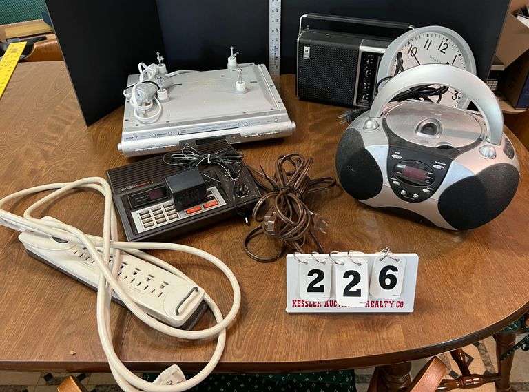 CD player, Wall Clock, Sony Cabinet Radio Player, AM/FM old radio Player, Ext. Cords, Misc.
