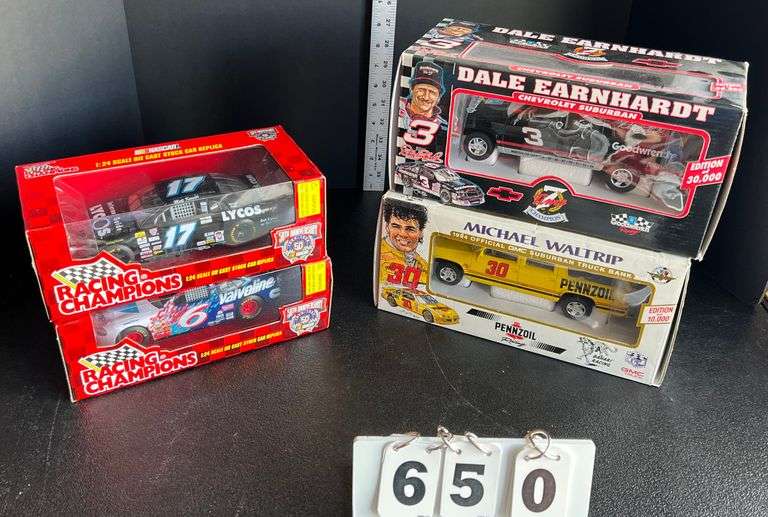 2 Truck Banks & 2 1:24 Die Cast Nascar Cars