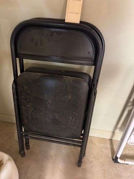 Two metal folding chairs