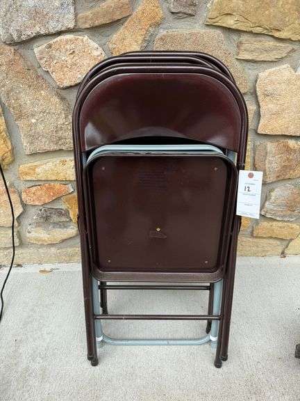 Four metal folding chairs