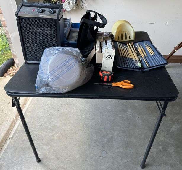 Card table, paint brushes, paint supplies