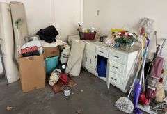 Everything in corner of garage except vanity