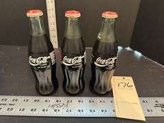 3 Coca Cola collector bottles