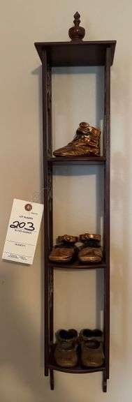 Shelf, bronze shoes
