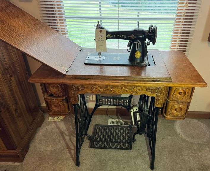 Singer sewing cabinet with state sewing machine