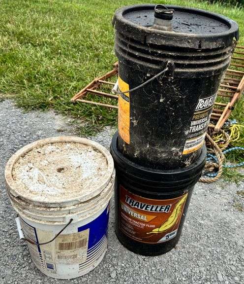 Clothes rack, old lawn mower, rope, buckets of oil