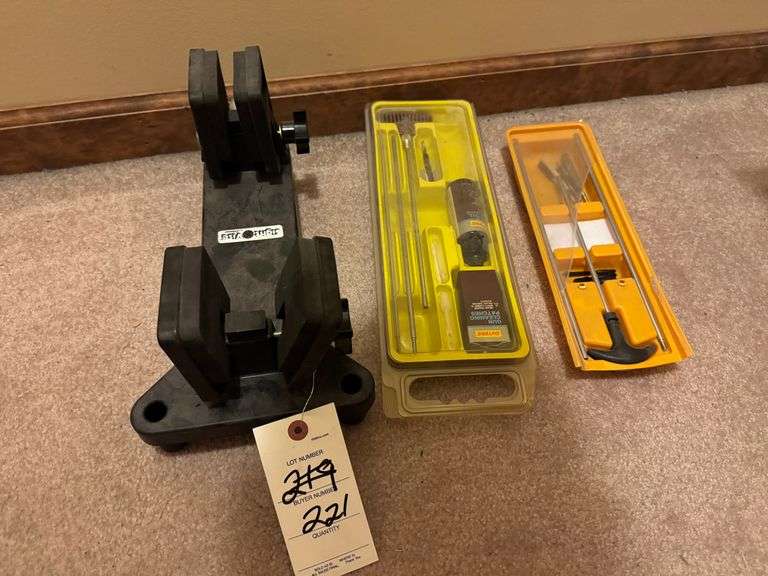 2 gun cleaning kits and vise