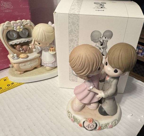 5 precious moments figurines and a book
