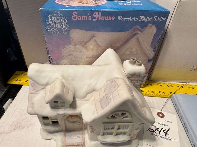 5 precious moments figurines and a book