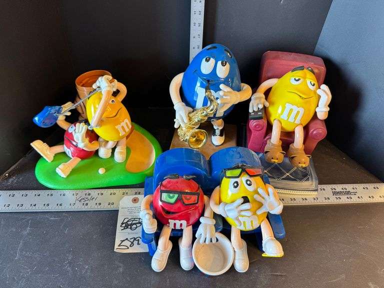 Four M & M dispensers