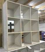 2 white cubby hole shelfs