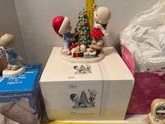 5 precious moments figurines and a book