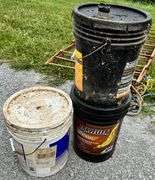 Clothes rack, old lawn mower, rope, buckets of oil