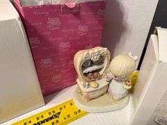 5 precious moments figurines and a book