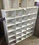 2 white cubby hole shelfs