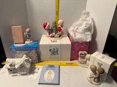 5 precious moments figurines and a book