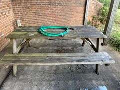 Picnic Table and Green Water Hose