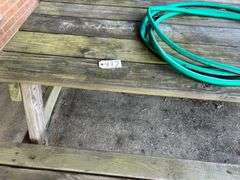 Picnic Table and Green Water Hose