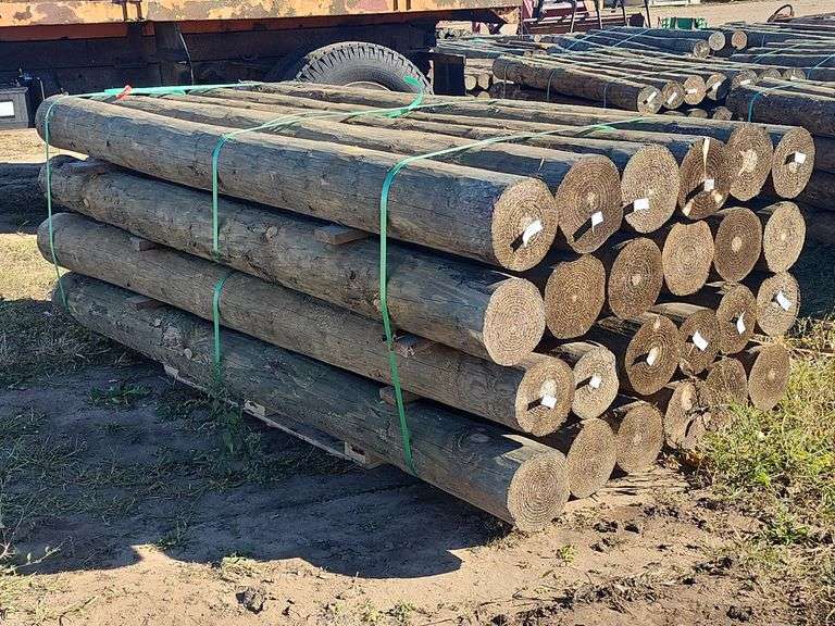 (JK) 24- 8" x 8' Treated Wooden Posts - Kraft Auction Service, LLC