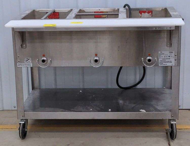 (D) Duke Hot Food Table with Three Wells And Cutting Board