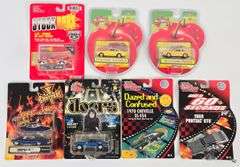 (7) 1/64 Die-Cast Cars In Blister Packages