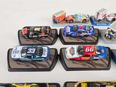 (14) 1/64 Scale Die-Cast Nascar Stock Cars On Display Stands
