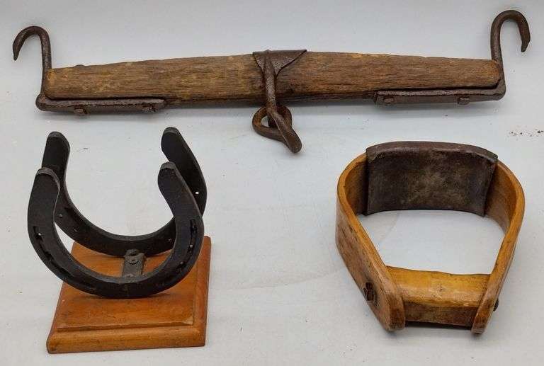 (DE) A wood oxen yoke (23" long), a bent wood stirrup, and a horseshoe napkin holder.