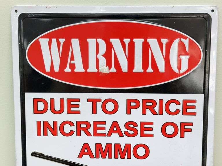 Warning Shot Embossed Metal Sign