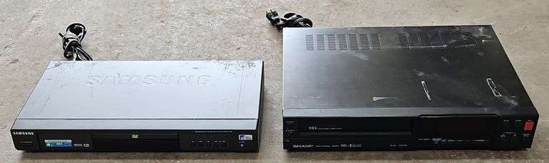 Samsung Progressive Scan Dvd Player & A Sharp Brand Professional Series VHS Player.