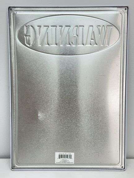Warning Shot Embossed Metal Sign