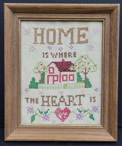 (Q) Framed Counted Crosstitch Piece Featuring Saying "Home Is Where The Heart Is"