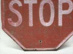 Vintage Embossed Metal Stop Sign