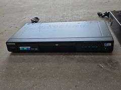 Samsung Progressive Scan Dvd Player & A Sharp Brand Professional Series VHS Player.
