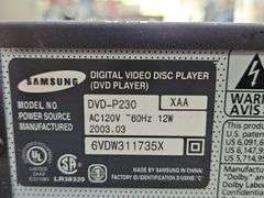 Samsung Progressive Scan Dvd Player & A Sharp Brand Professional Series VHS Player.