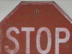 Vintage Embossed Metal Stop Sign