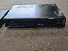 Samsung Progressive Scan Dvd Player & A Sharp Brand Professional Series VHS Player.
