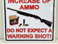 Warning Shot Embossed Metal Sign
