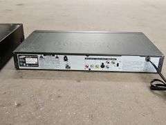 Samsung Progressive Scan Dvd Player & A Sharp Brand Professional Series VHS Player.