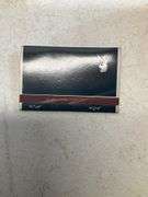Matchbook collection with candles and holder