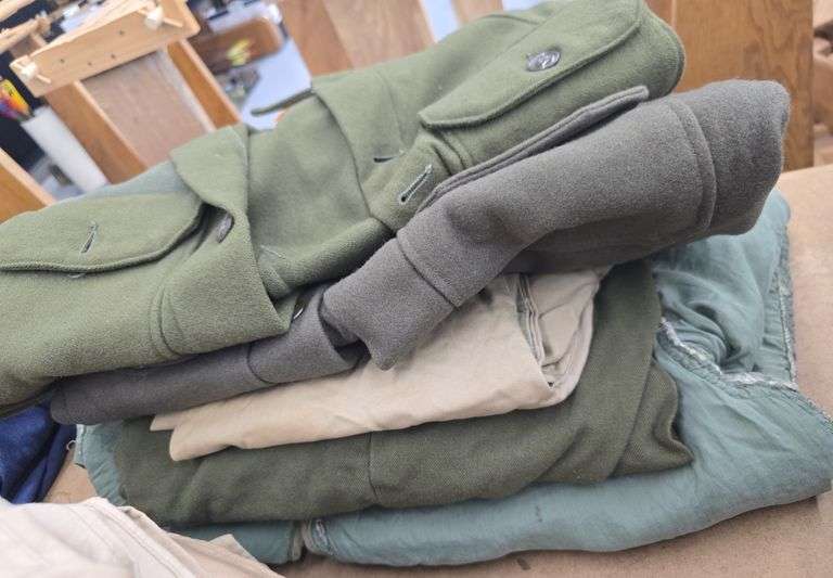 2 stacks of Military Uniforms - Kramer Auction LLC