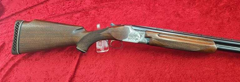 Sierra Arms Corp.   Model 90  12 ga.   O/U Trap Gun