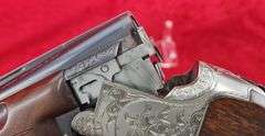 Sierra Arms Corp.   Model 90  12 ga.   O/U Trap Gun