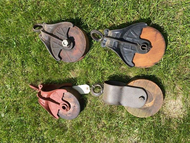 Four Wooden Pulleys