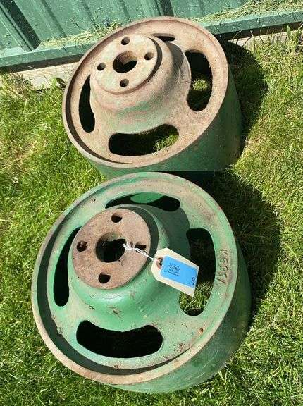 Two Oliver Cast Iron Pulleys