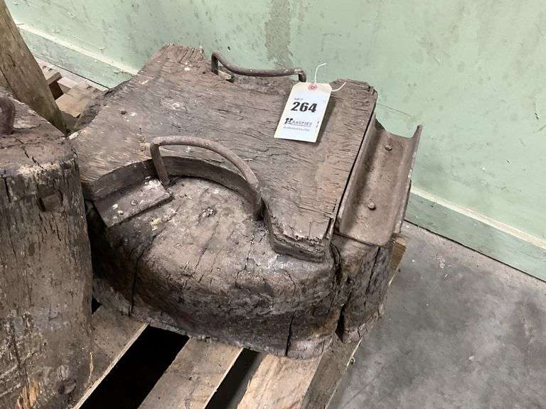 Homemade anvil stand on a tree stump Kraupie's Real Estate & Auctioneers