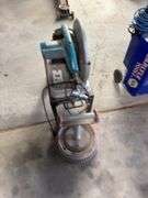 Makita chopsaw on rolling stand with diamond blade and metal stand