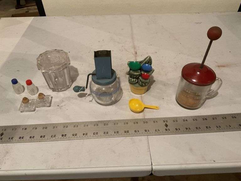 Measuring cup holder, two nut grinders,